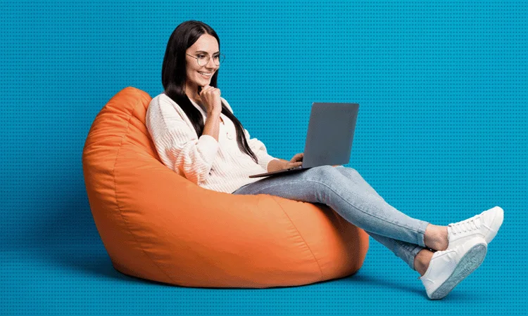 Woman sitting on a beanbag looking at the best elearning examples