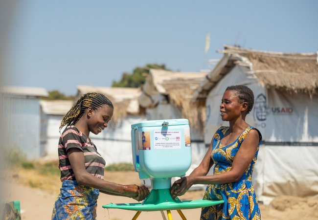 Oxfam brand image of women at a well
