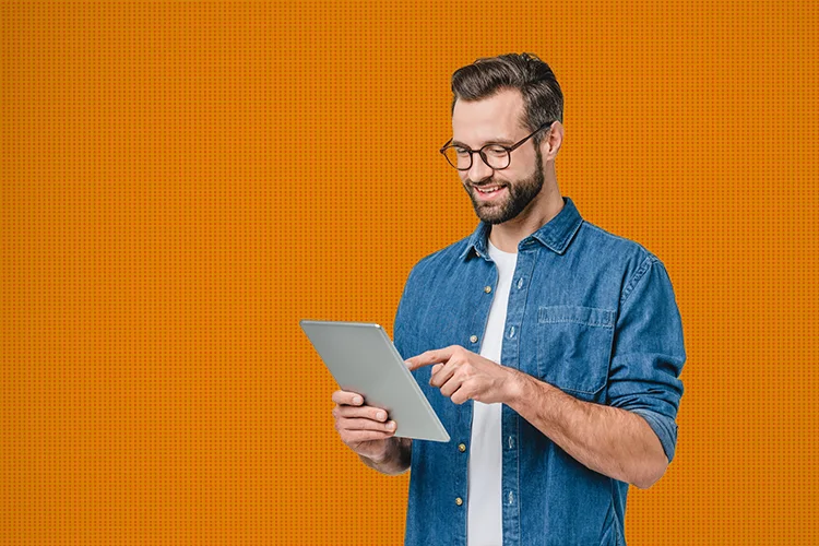 Man on tablet engaging with enterprise elearning