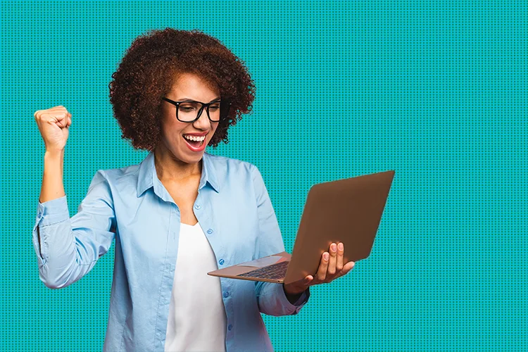 Woman on laptop cheering - elearning engagement