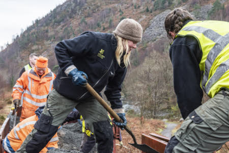 Image of people working on a National Trust site, digging